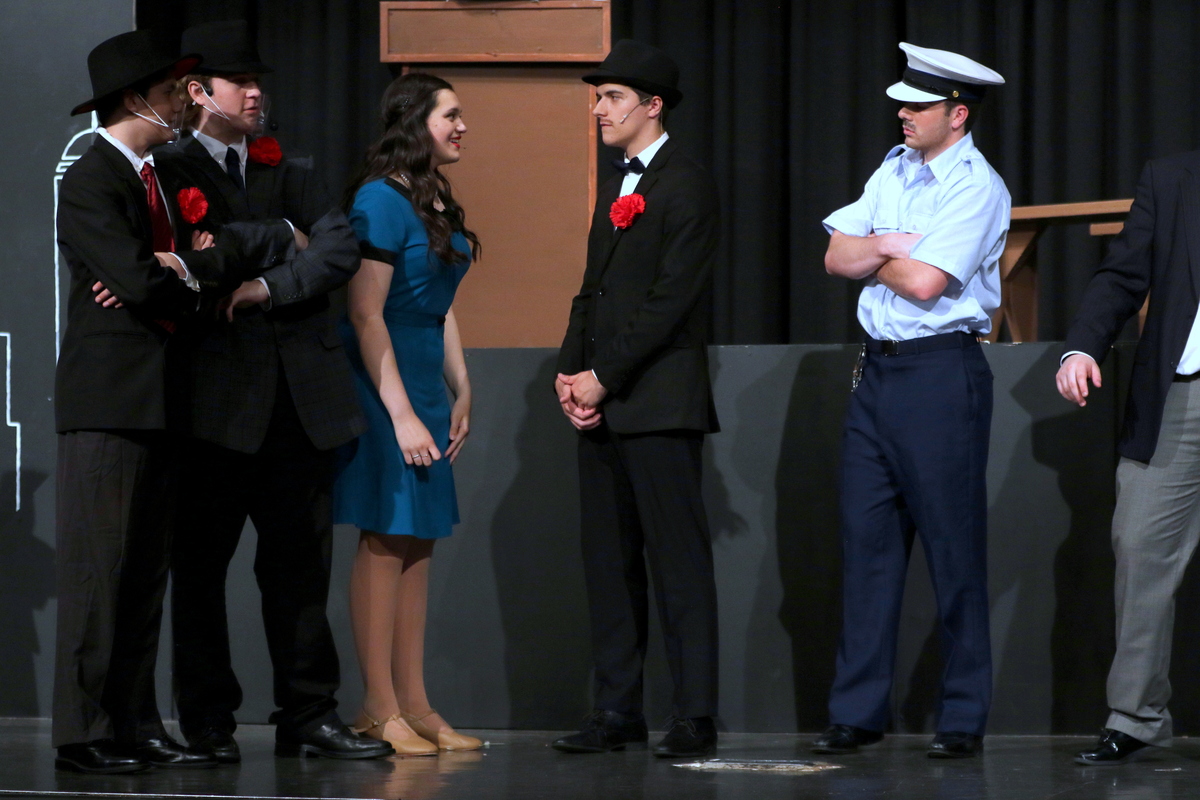 Guys and Dolls cast members on stage