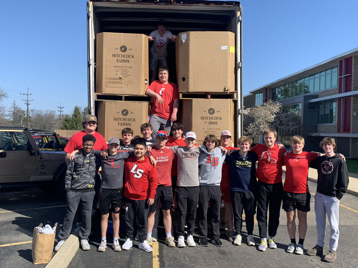 students in front of semi truck