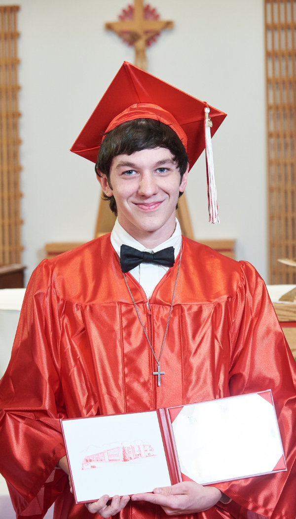Elijah with cap, gown and diploma