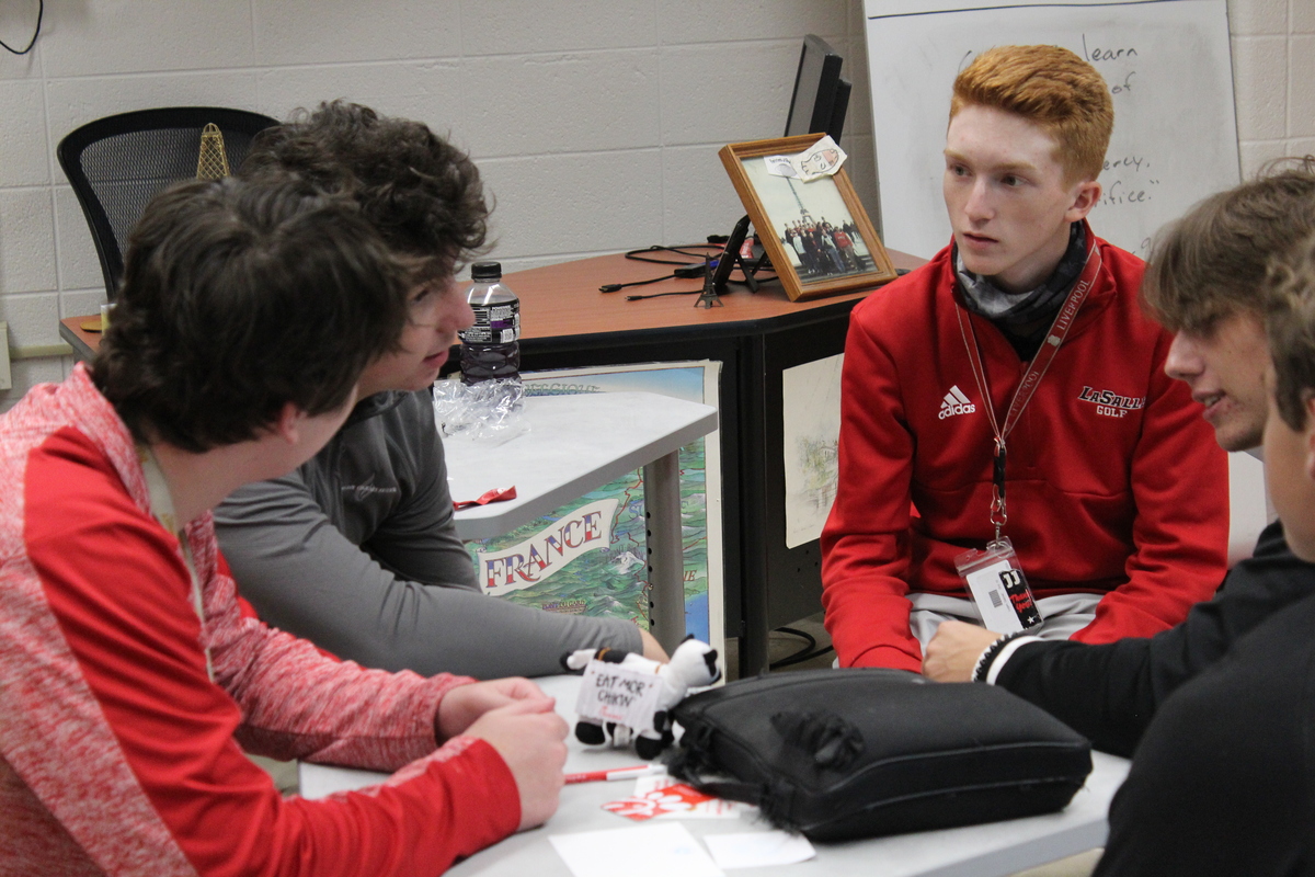 Students sit at desks