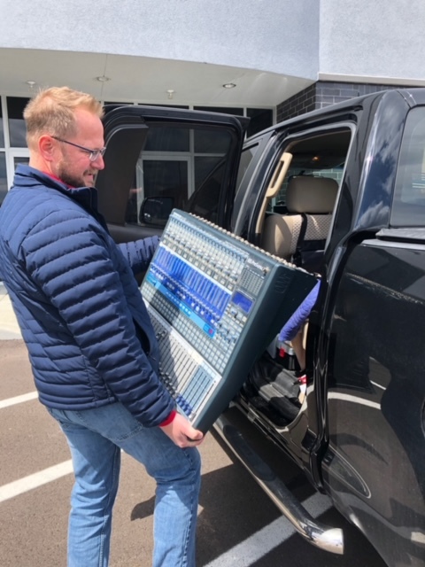 Owner, Jim, loading soundboard into truck